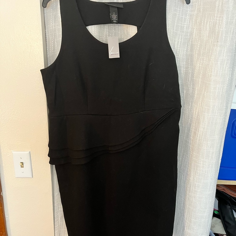 Black form fitting, knee length dress, size 16